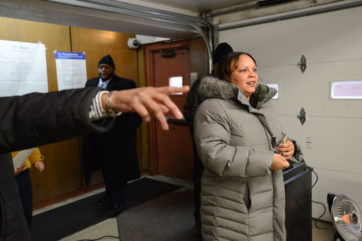 Alderman of the 7th Ward, Natashia Holmes, is directed into her polling place. Tuesday, February 24, 2015 | Brian Jackson/ Sun-Times